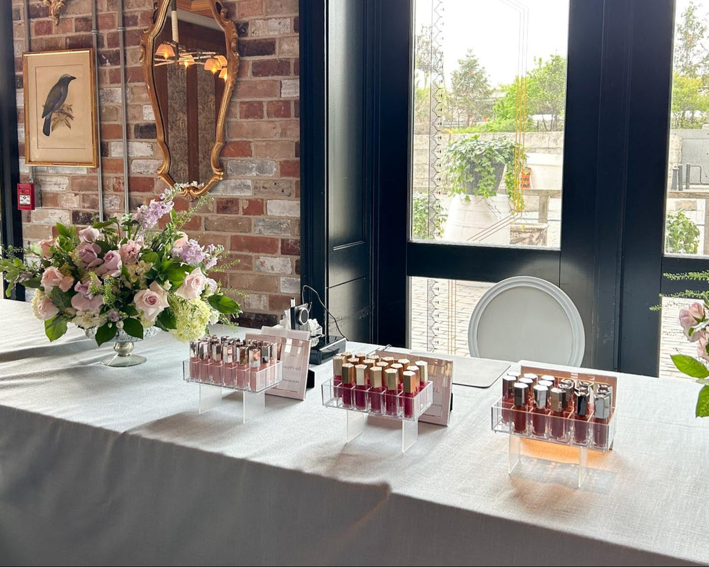 Toronto calligrapher engraver Jessie Wang engrave on Fenty gloss bomb lip glosses for a Toronto bridal shower event