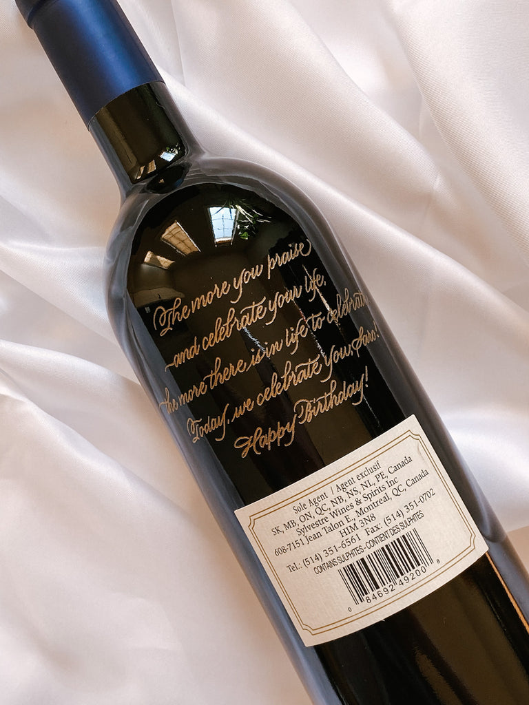 Wine bottle engraving by Toronto calligrapher engraver, Jessie Wang, for corporate gifting