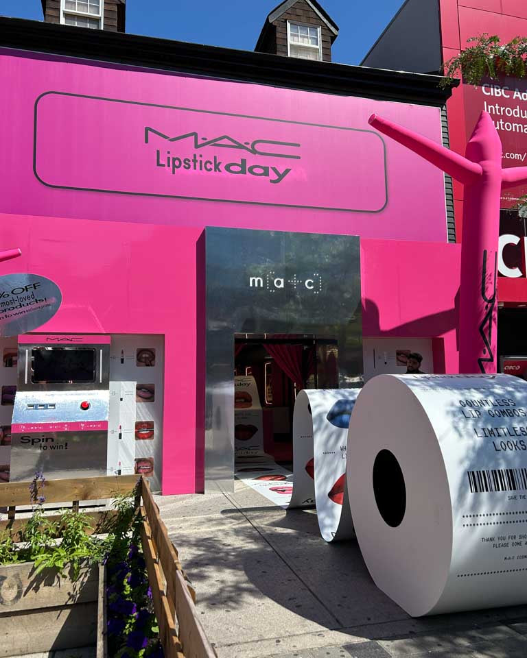 MAC Lipstick Day Toronto pop-up installation with pink branding and interactive event setup.