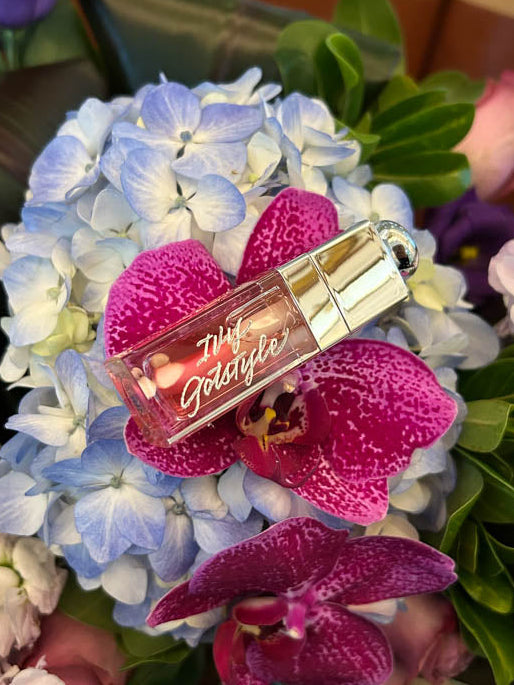 Personalized Dior lipstick engraved with guest name, displayed on floral bouquet at Toronto wedding.
