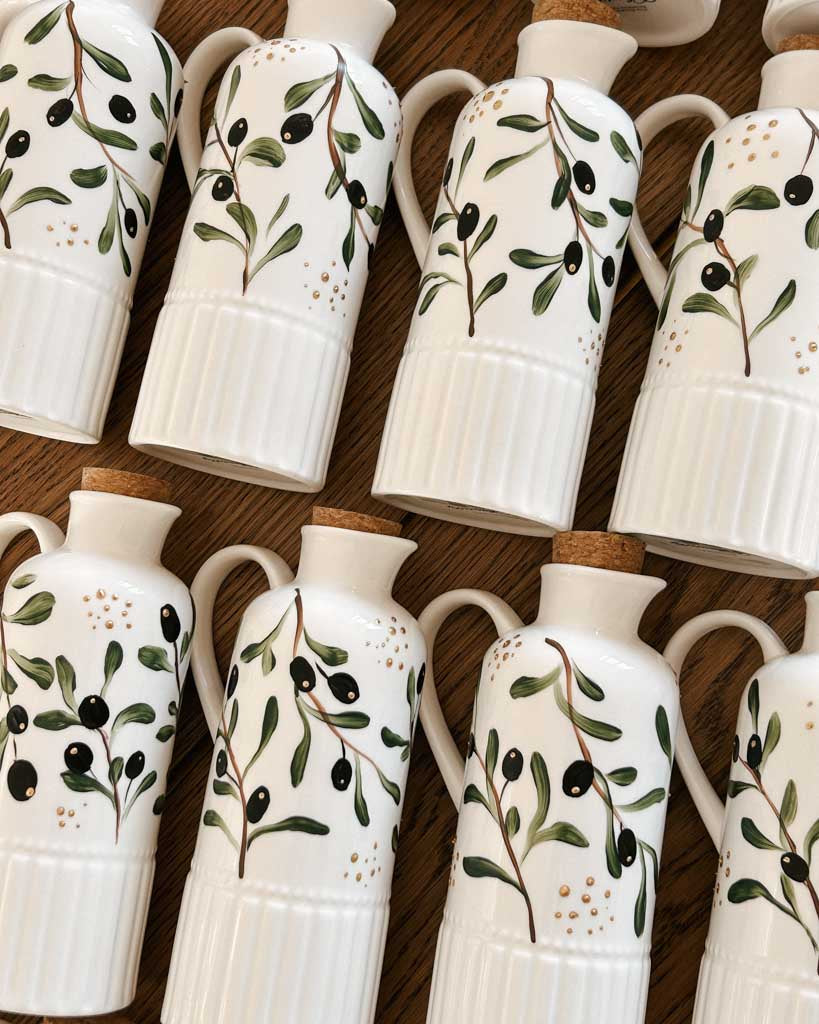 Olive branch hand-painted ceramic bottles designed as personalized wedding favors for Toronto couples.