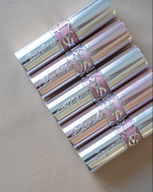 Luxury YSL lipsticks engraved live with guest names by Toronto calligrapher Jessie Wang.